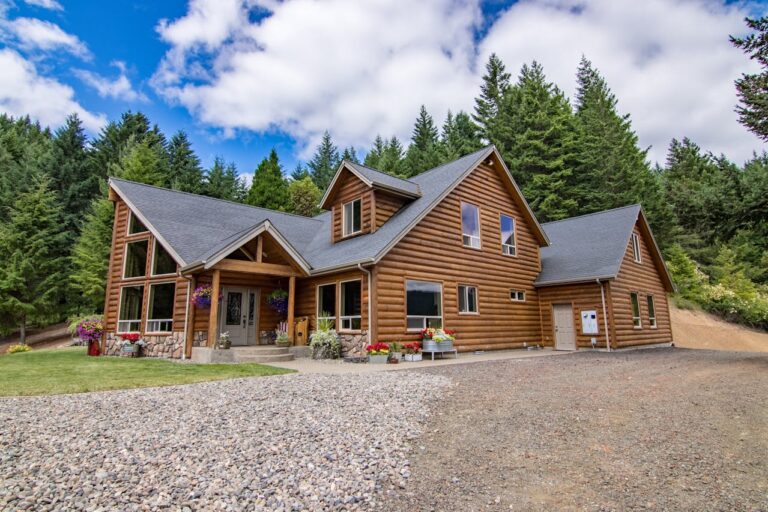 Brown Wooden House Surrounded by Green Trees